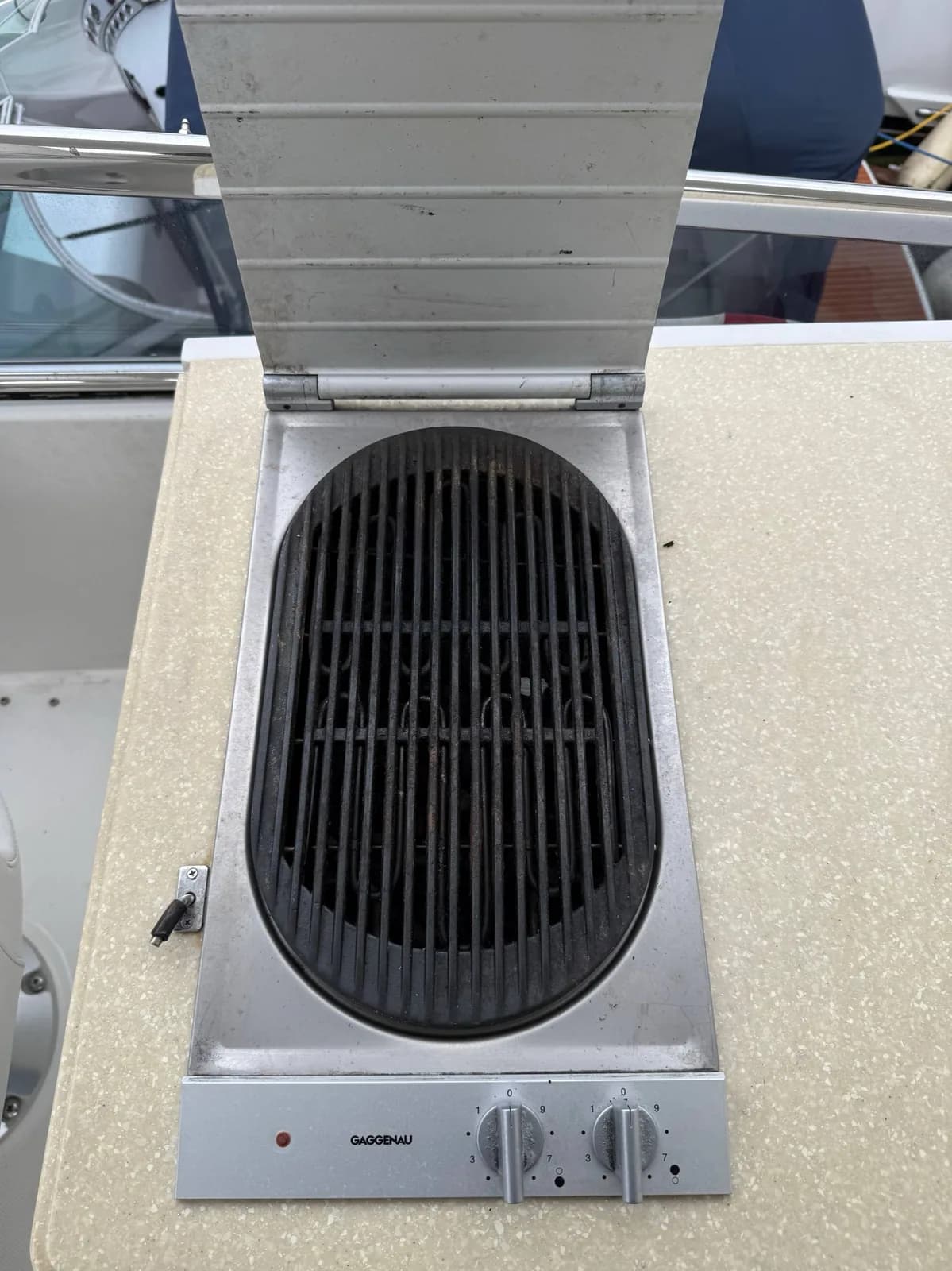 A Gaggenau cooktop with a grill insert from above, integrated into a countertop