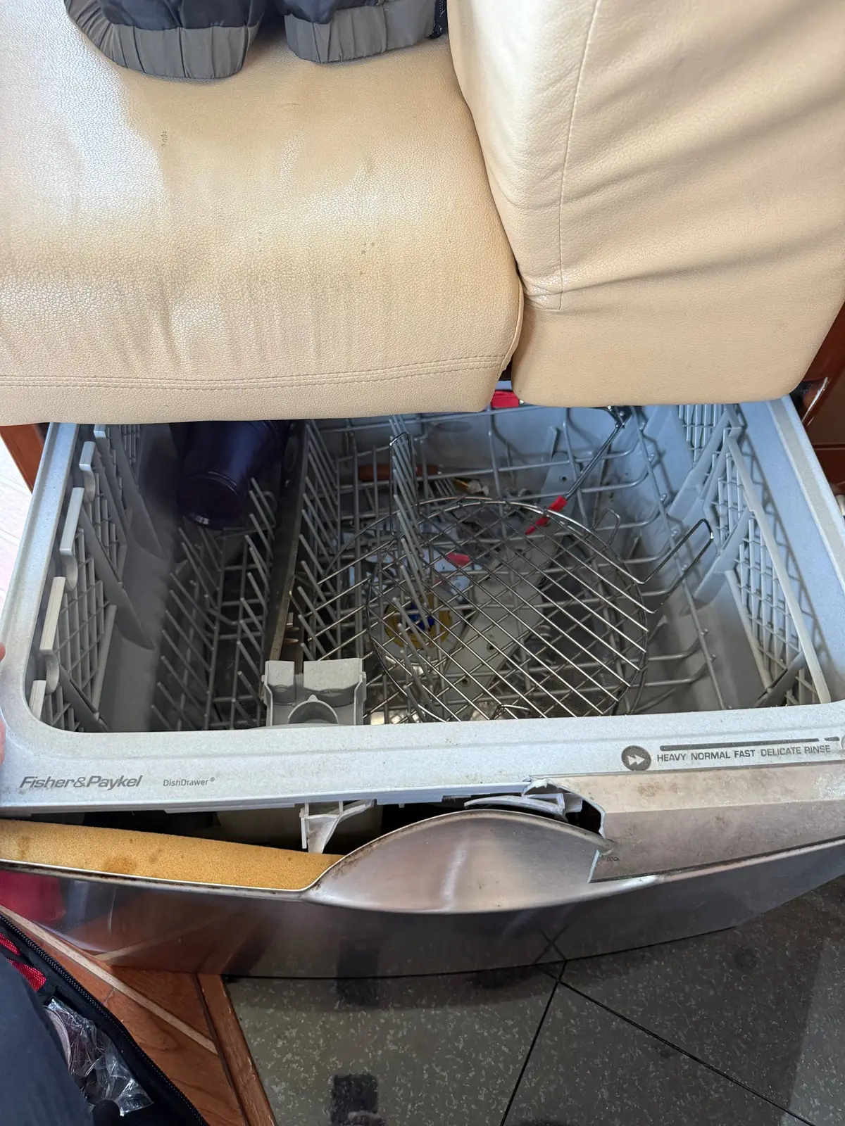 A Fisher & Paykel DishDrawer dishwasher open, with its rack visible