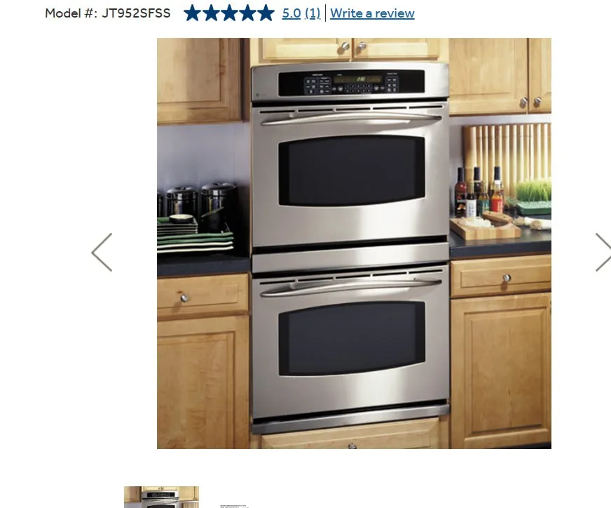 A stainless steel double oven is installed in a kitchen with wood cabinetry