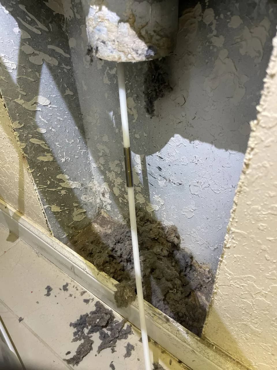 Berne technician cleaning HVAC air ducts in South Florida