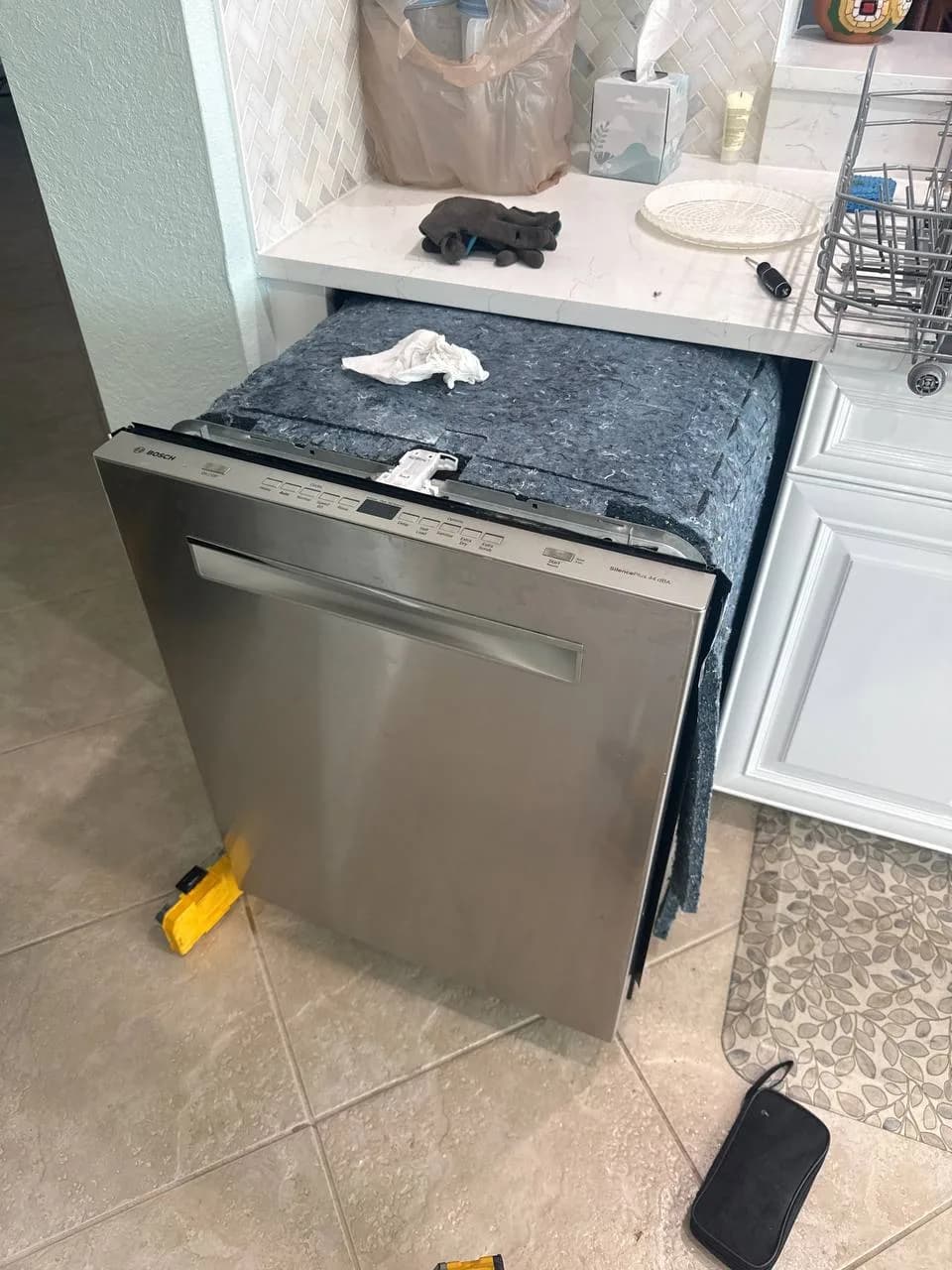 Berne technician repairing a dishwasher in South Florida