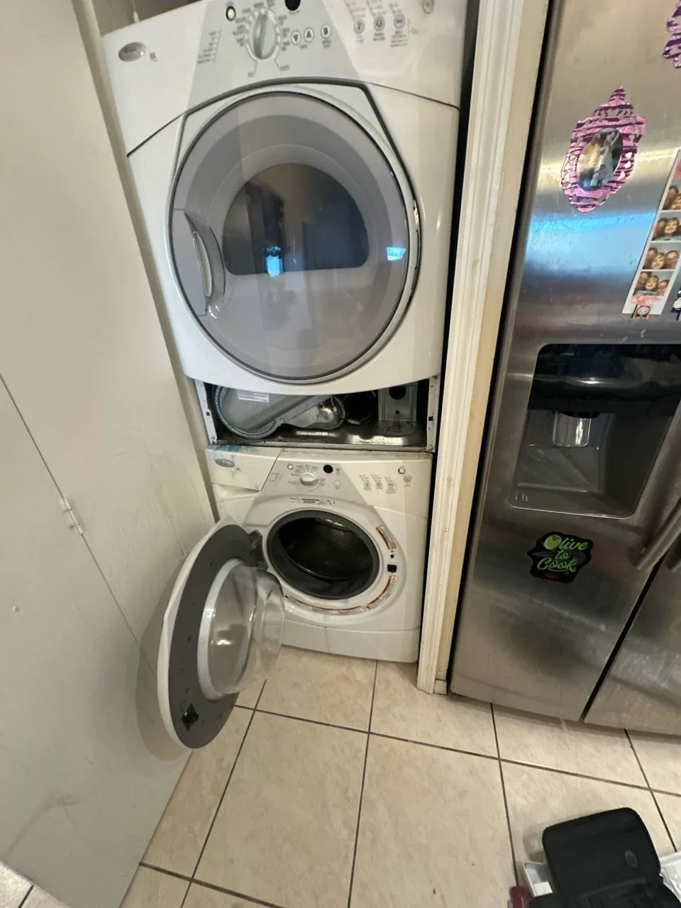 Berne technician servicing a clothes dryer in South Florida