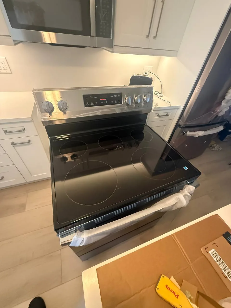 Berne technician repairing an oven in South Florida