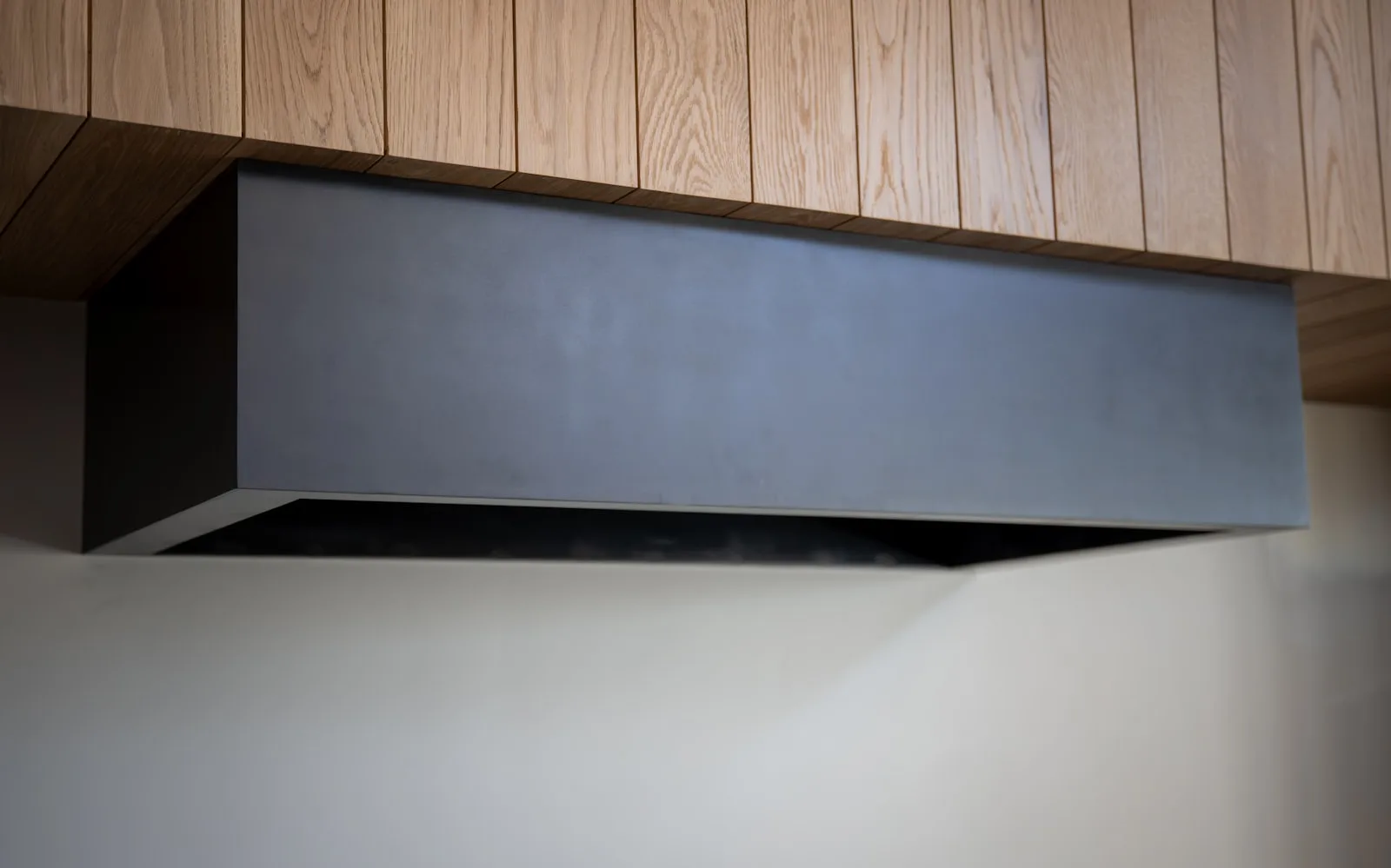 Berne technician repairing a range hood in South Florida