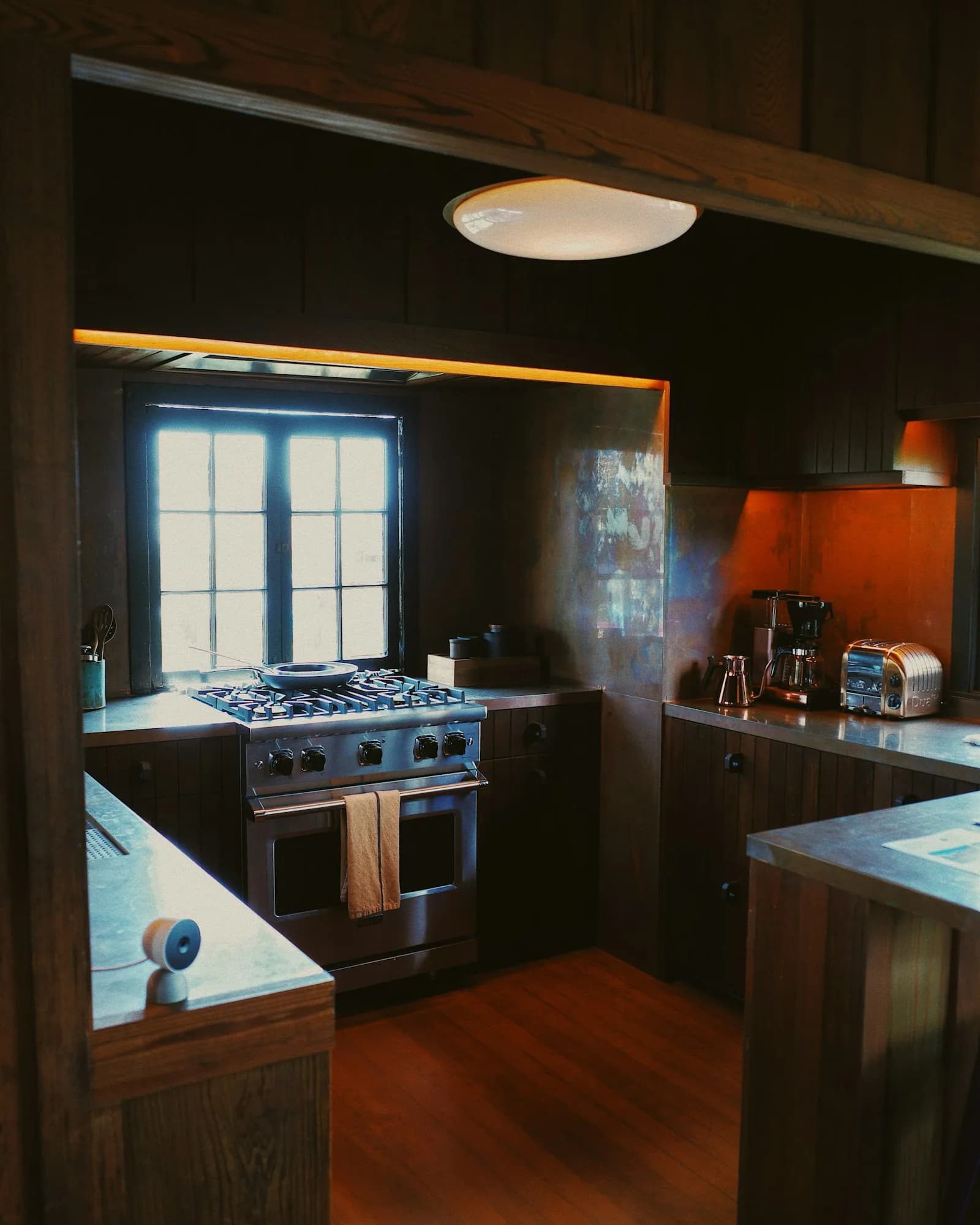 Wall-mount range hood damper and duct inspection by a Berne technician