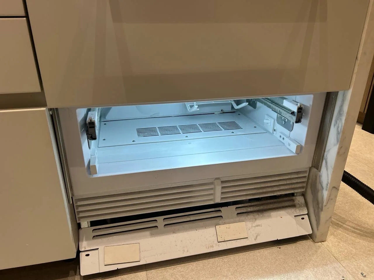 Berne technician diagnosing a refrigerator in South Florida