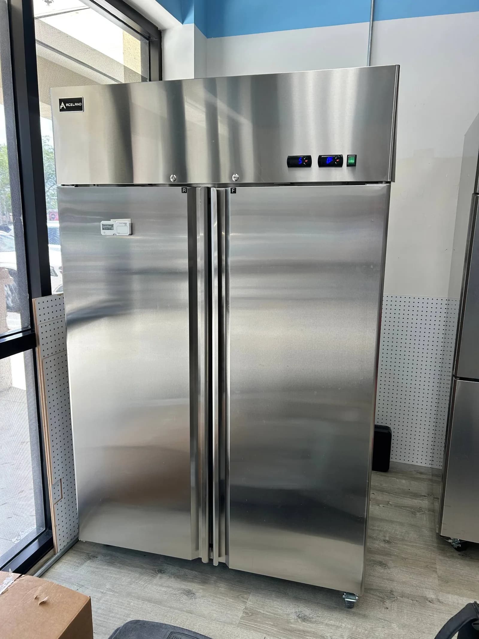 Refrigerator door seal and gasket inspection by a Berne technician