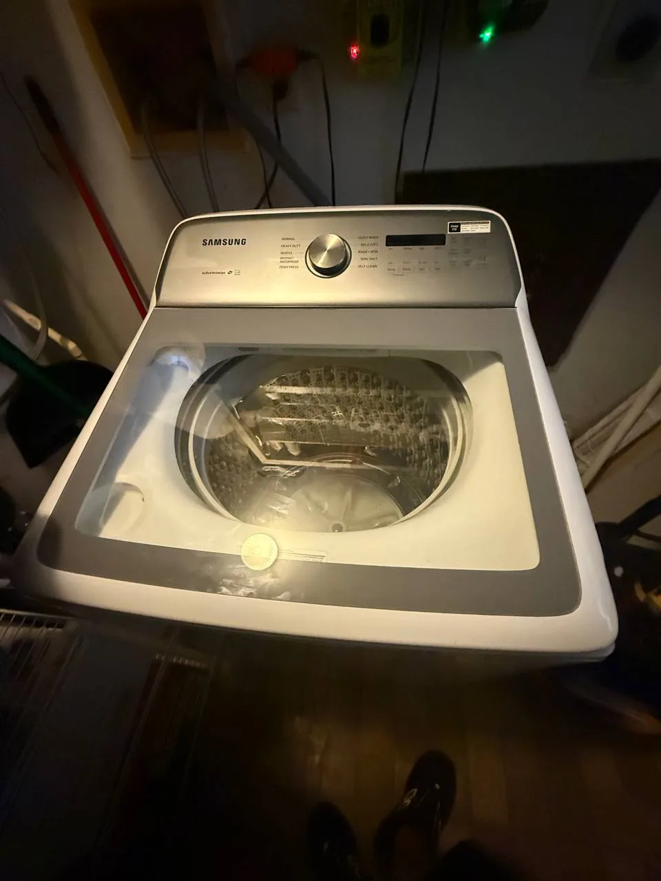 Berne technician repairing a washing machine in South Florida